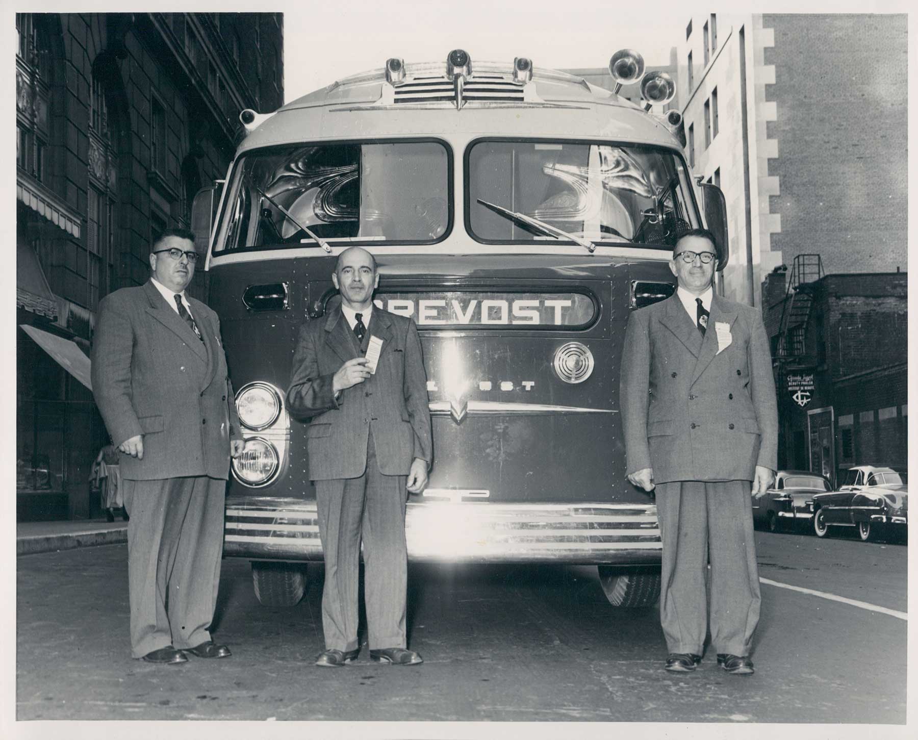 Eugene Prevost,  Louis Bilodeau-VP- and Albert Lacombe-seller- in front of a luxury 37 passengers for Montreal Convention 